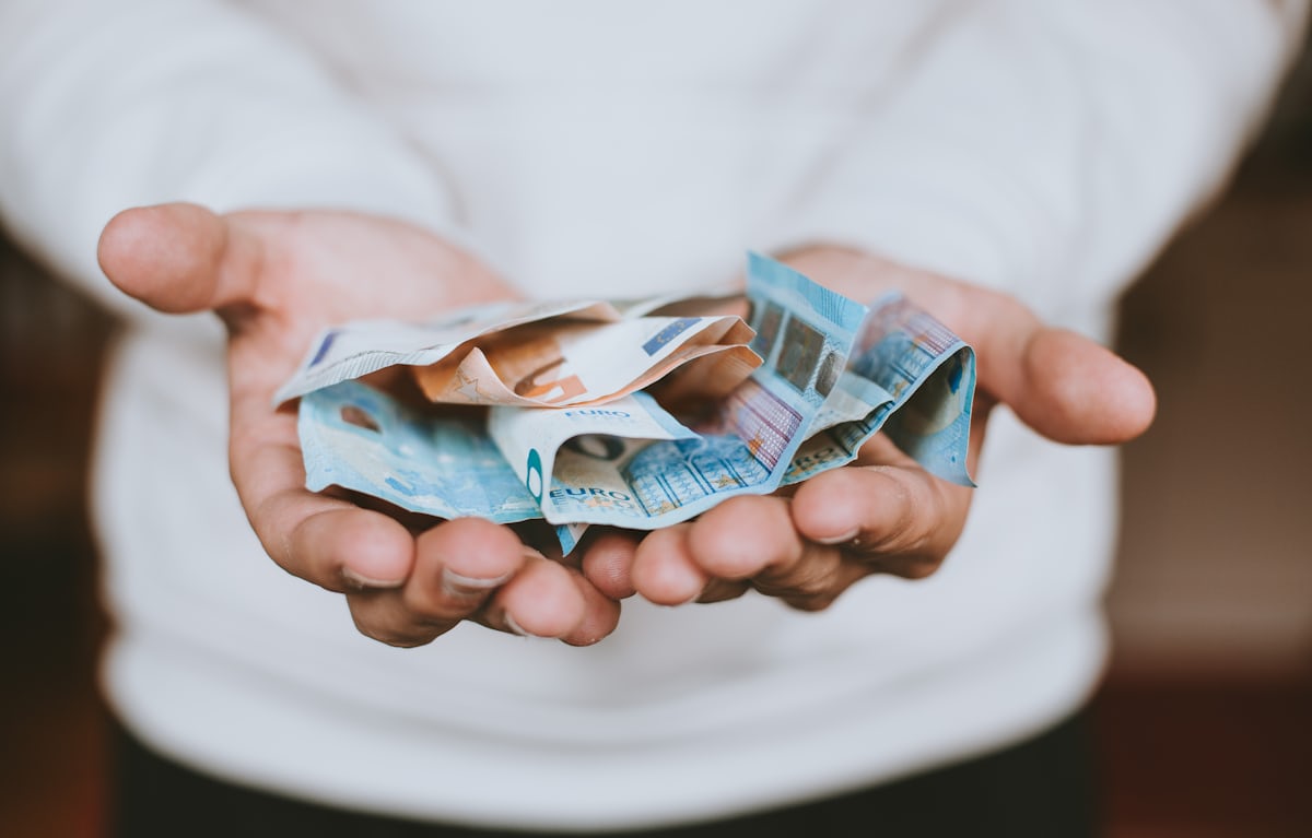 Hands holding banknotes