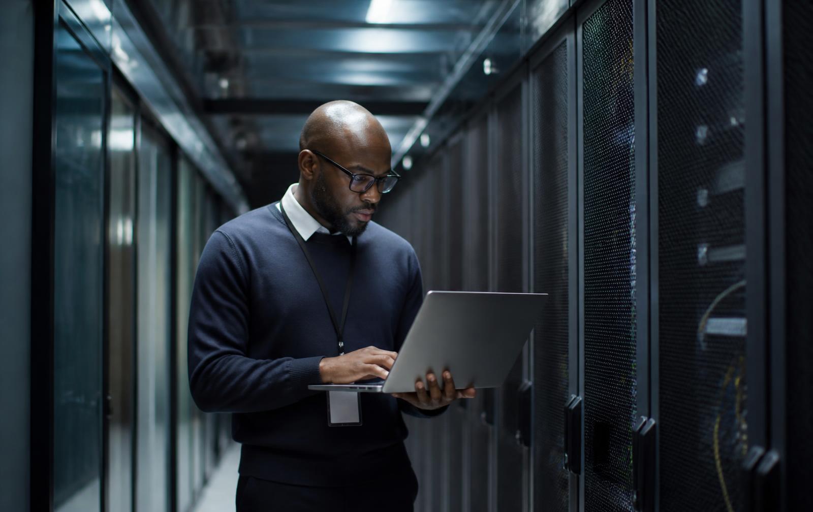 Investment professionals examining a property model in a secure data centre